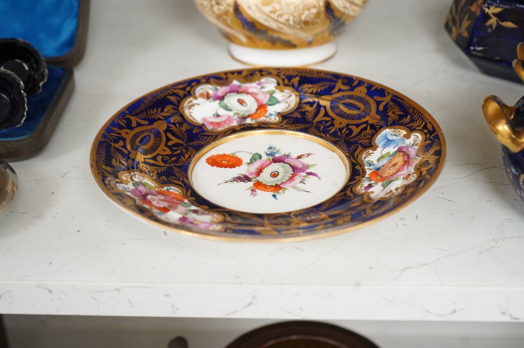 A Group of early 19th century English porcelain; to sauce tureens and covers, one with stand, a covered sugar bowl, a two handled vase, a pot pourri vase and cover, a milk jug and a hydra shaped jug, largest 16cm high
